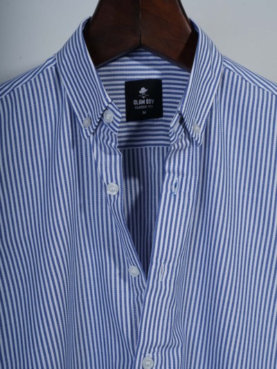 blue and white striped button-down shirt.